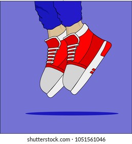 Hype red kicks on young kid`s legs jumping. Blue background