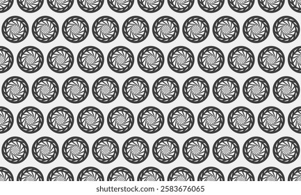 Hypnotic grayscale pattern featuring repeating circular motifs.  Perfect for backgrounds, textiles, or web design, this image evokes a sense of movement and visual intrigue.