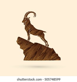 Ibex standing on the cliff designed using brown grunge brush graphic vector.