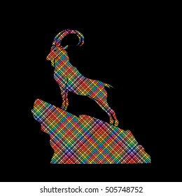 Ibex standing on the cliff designed using colorful pixels graphic vector.