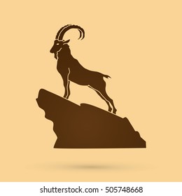 Ibex standing on the cliff graphic vector.