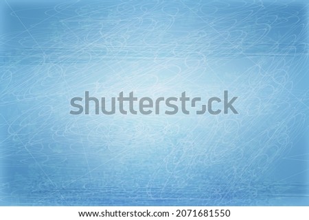 Ice background or area with scratches and skate marks. Ice arena for winter sports.