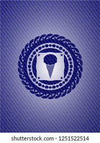 ice cream icon inside badge with denim background