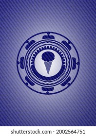 ice cream icon inside badge with denim background. 
