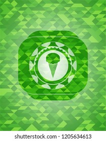 ice cream icon inside green emblem with mosaic background