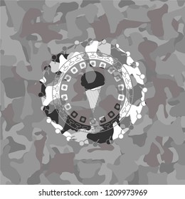 ice cream icon inside grey camouflaged emblem