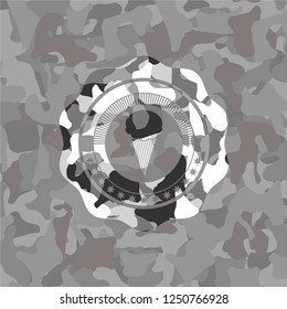 ice cream icon inside grey camouflage emblem