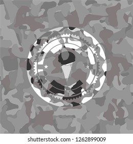 ice cream icon inside grey camouflage texture