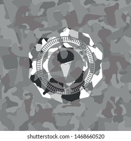 ice cream icon inside grey camo emblem