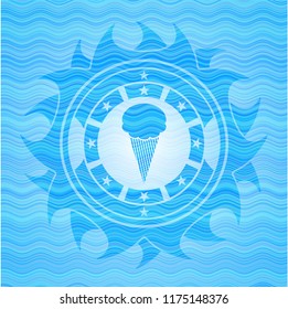 ice cream icon inside light blue water wave badge background.