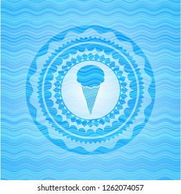 ice cream icon inside light blue water wave badge background.