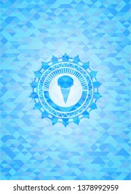 ice cream icon inside light blue emblem with triangle mosaic background