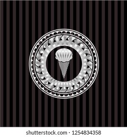 ice cream icon inside silver emblem