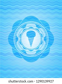 ice cream icon inside sky blue water wave style badge.