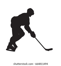 Ice hockey player skating with puck, side view, vector silhouette