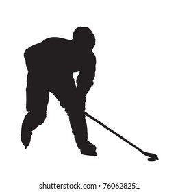 Ice hockey player skating with puck, isolated vector silhouette