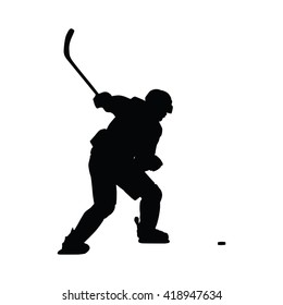 Ice hockey player vector silhouette. Hockey player shoots the puck on goal, isolated silhouette. Shooting hockey player