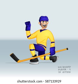 ice hockey player in yellow uniform sliding in happiness after puck shot