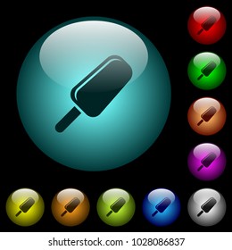 Ice lolly icons in color illuminated spherical glass buttons on black background. Can be used to black or dark templates