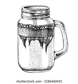 Iced coffee with milk in mason jar