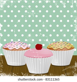 iced cupcakes in white cases on a distressed retro style background