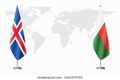 Iceland and Madagascar flags for official meeting against background of world map.