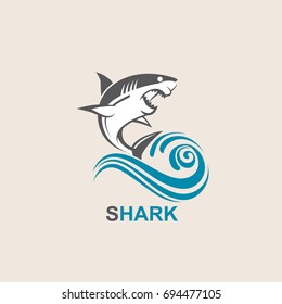 icon of angry shark with sea waves