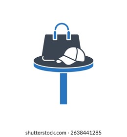 Icon of a bag and hat placed on a table.