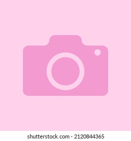 ICON OF THE CAMERA IN A PINK COLOR ON A WHITE BACKGROUND