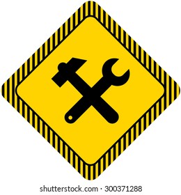 Icon of crossed hummer and spanner