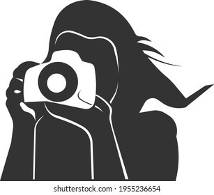 The icon of a girl taking pictures with a camera. Image Photographer is designed for designing and developing websites and applications. Vector illustration isolated on a white background.