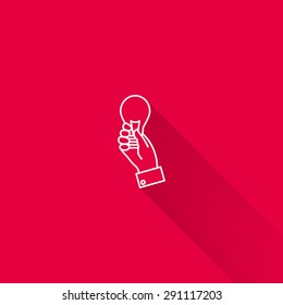Icon of manâ??s hand holding lightbulb