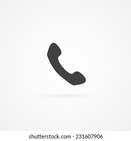 Icon of handset. White background and shadow.