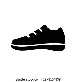 icon illustration of men's shoes in solid black style