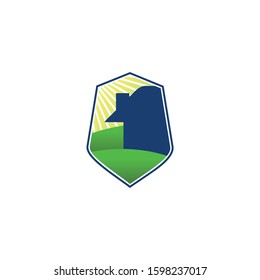 icon or logo of a shield with house and landscape scenery within
