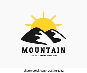 Icon logo of two mountains with the sun. Logo of the peak of  mountain. Simple circular vector logo in a modern style. Silhouette of mountains or hills.