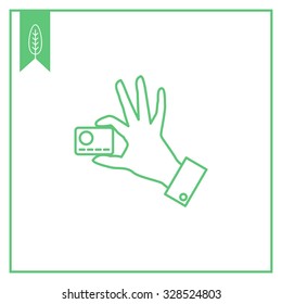 Icon of man hand holding credit card with two fingers