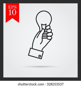 Icon of man hand holding lightbulb