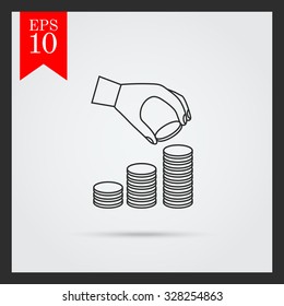 Icon of man hand putting coin  onto coin stack