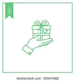 Icon of man's hand holding gift box with ribbon and bow