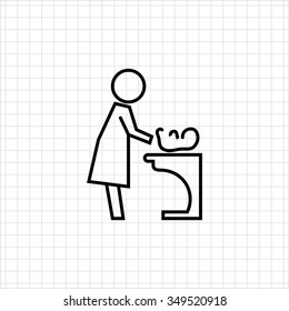 Icon of mother changing diaper with baby lying on changing table
