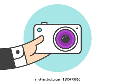 Icon of photo camera in the businessman hand. White camera in line graphic. Hand of businessman holds the camera icon. Icon of photo camera isolated on a blue circle. Vector Illustration