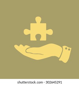 icon puzzle in a man's hand