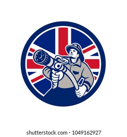 Icon retro style illustration of a British firefighter or fireman holding a fire hose front view  with United Kingdom UK, Great Britain Union Jack flag set inside circle on isolated background.