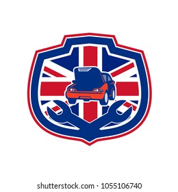 Icon retro style illustration of a British auto automobile car repair shop with crossed spanner wrench and United Kingdom UK, Great Britain Union Jack flag set inside crest on isolated background.