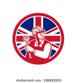 Icon retro style illustration of a British mechanical engineer holding a spanner or wrench with United Kingdom UK, Great Britain Union Jack flag set inside circle on isolated background.