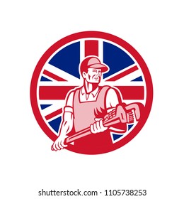 Icon retro style illustration of a British plumber and gasfitter holding monkey wrench with United Kingdom UK, Great Britain Union Jack flag set inside circle on isolated background.