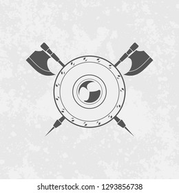 Icon of round shield and crossed axes vector illustration