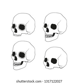 Icon set of isolated skulls in doodle style.