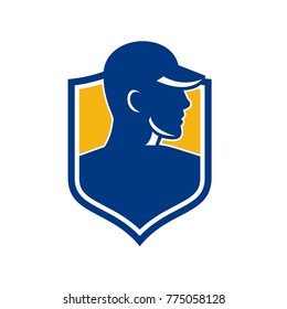 Icon style illustration of an Industrial Worker wearing hat set inside shield Crest on isolated background.